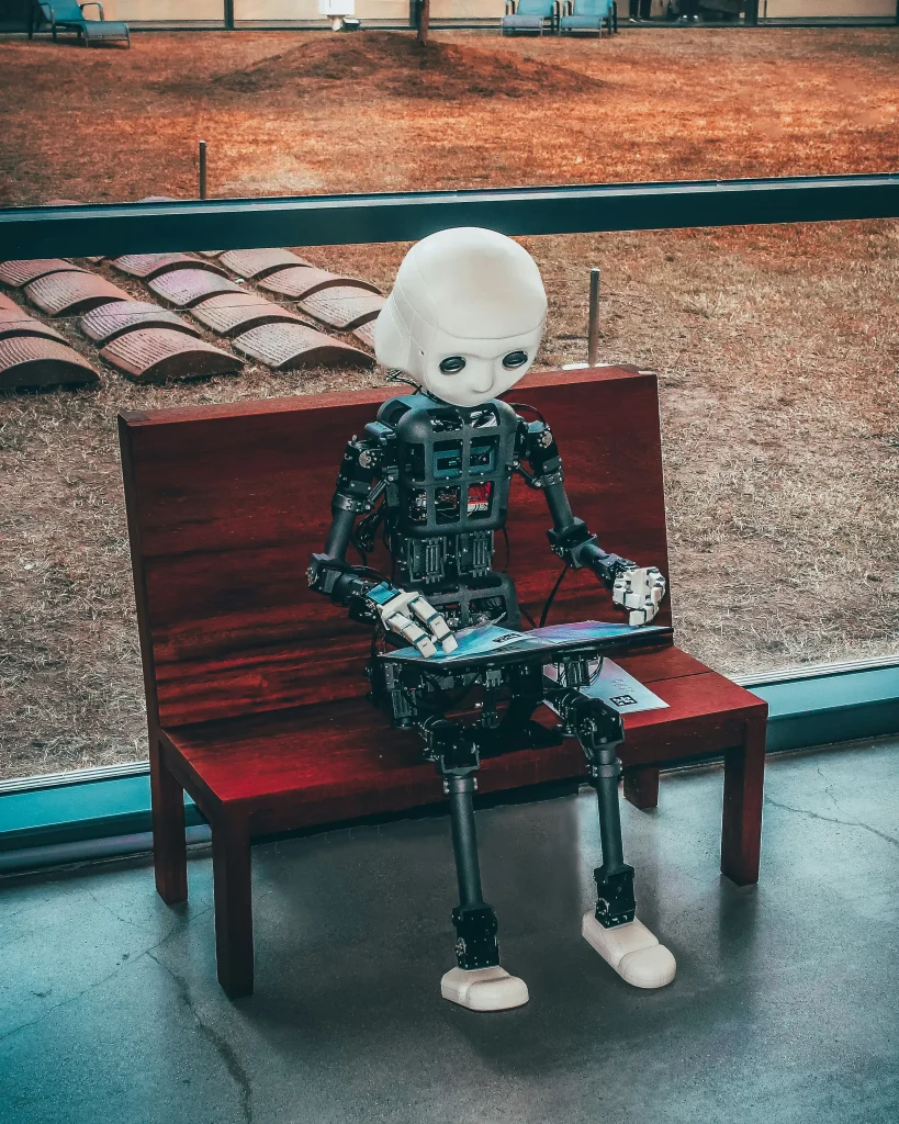 andrea-de-santis-zwd435-ewb4-unsplash robot sitting